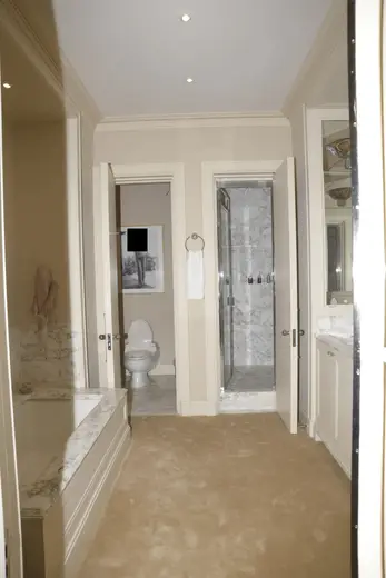 Bagno: EFTA00000613 - Luxurious bathroom with marble countertops a bathtub a shower and a toilet 