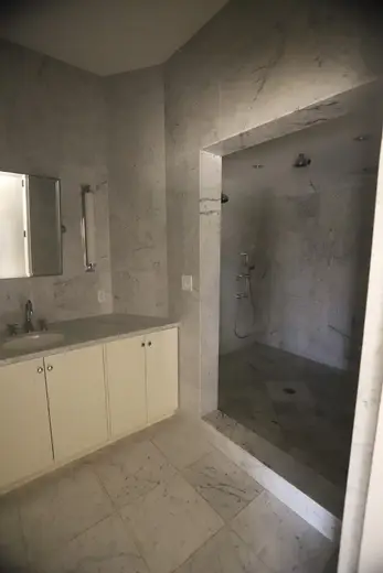 Bagno: USVI IMG 5426 - Elegant marble bathroom with a sleek vanity and walk-in shower featuring p