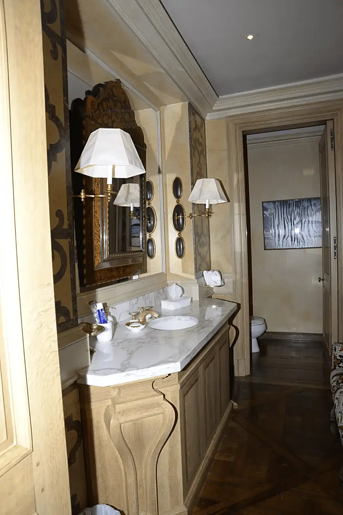 Baño: EFTA00000124 - Elegant bathroom with marble countertop ornate wooden vanity and classic wa