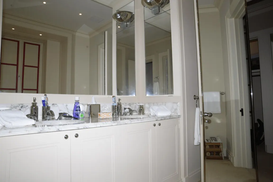Bathroom: EFTA00000615 - Spacious bathroom featuring a double sink with marble countertop white cabi