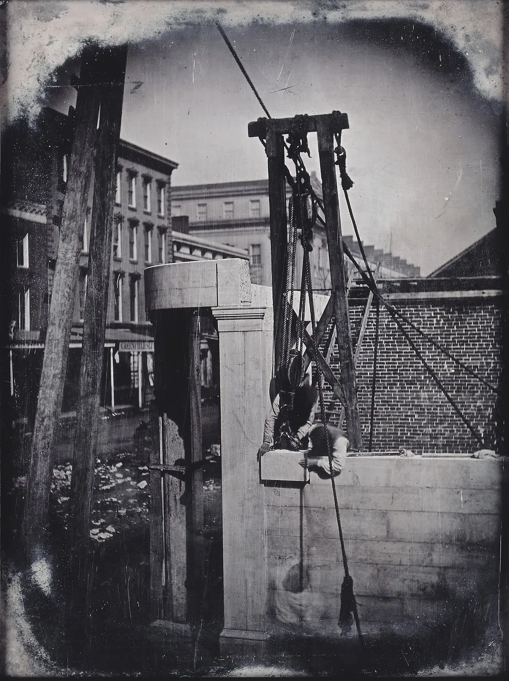 Quarry block: Construction of Marble Building, Northeast Corner of Fourth and Olive Streets, Workmen wit