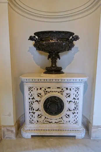 Surface detail: Urn atop Lorandini stove with Carlo Marochetti medallion based on Jean Goujon’s work at Ho