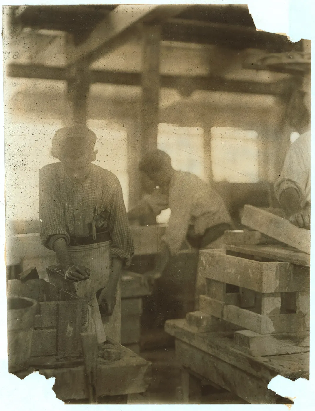 Surface detail: Young boy polishing marble in Vermont Marble Co., Centre Rutland, Vt. Most of these are il